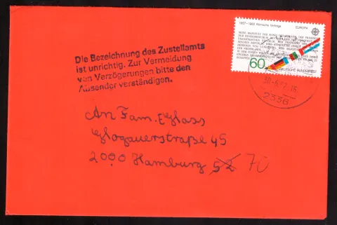Misdirected red cover with postal correction notice